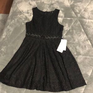 Super cute little black dress. lace floral detail.